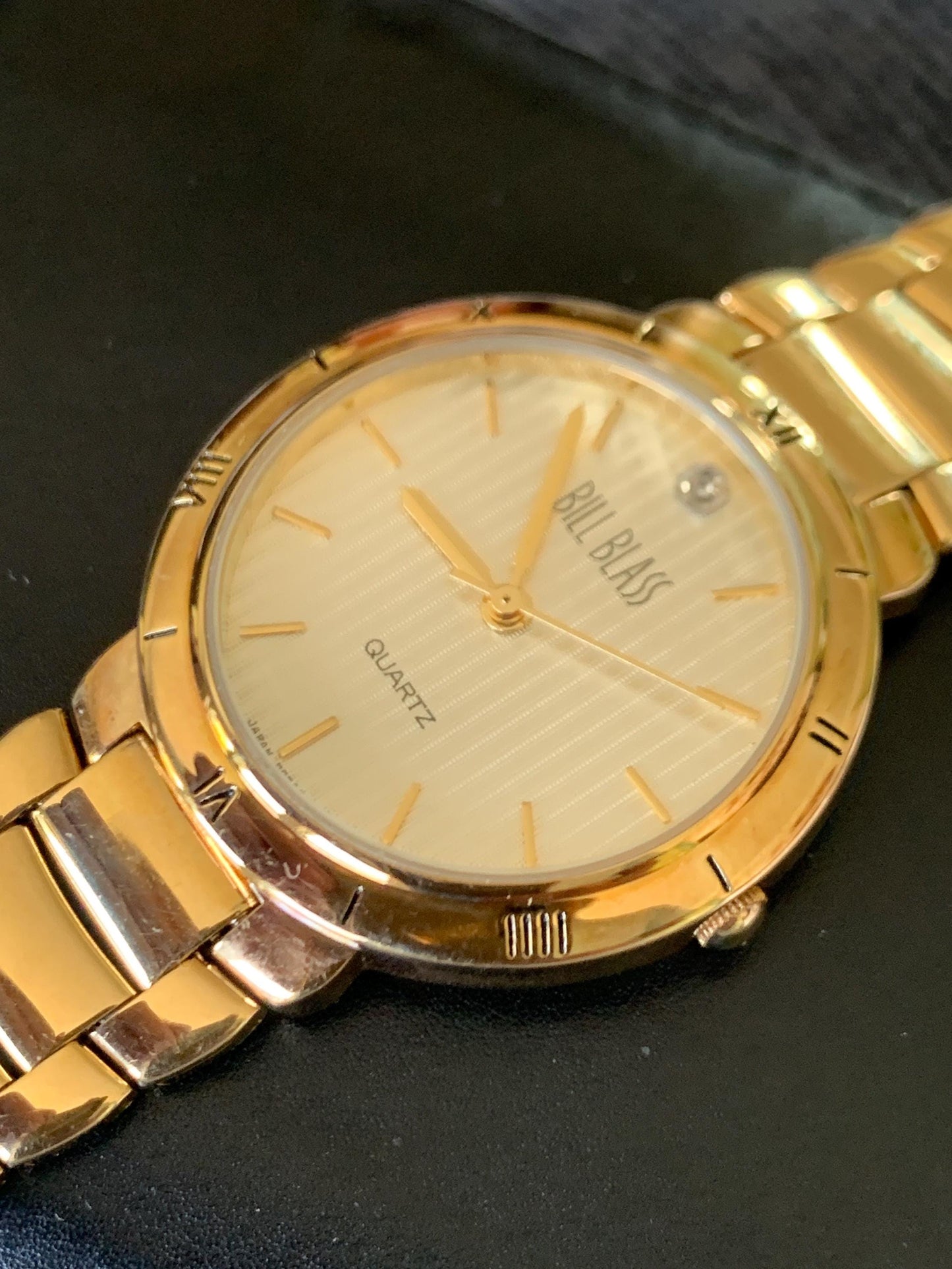 Classic Bill Blass Quartz Watch - Elegant Striped Dial with Roman Bezel, Goldtone, Excellent Condition, Integral Bracelet, Slim, All links.