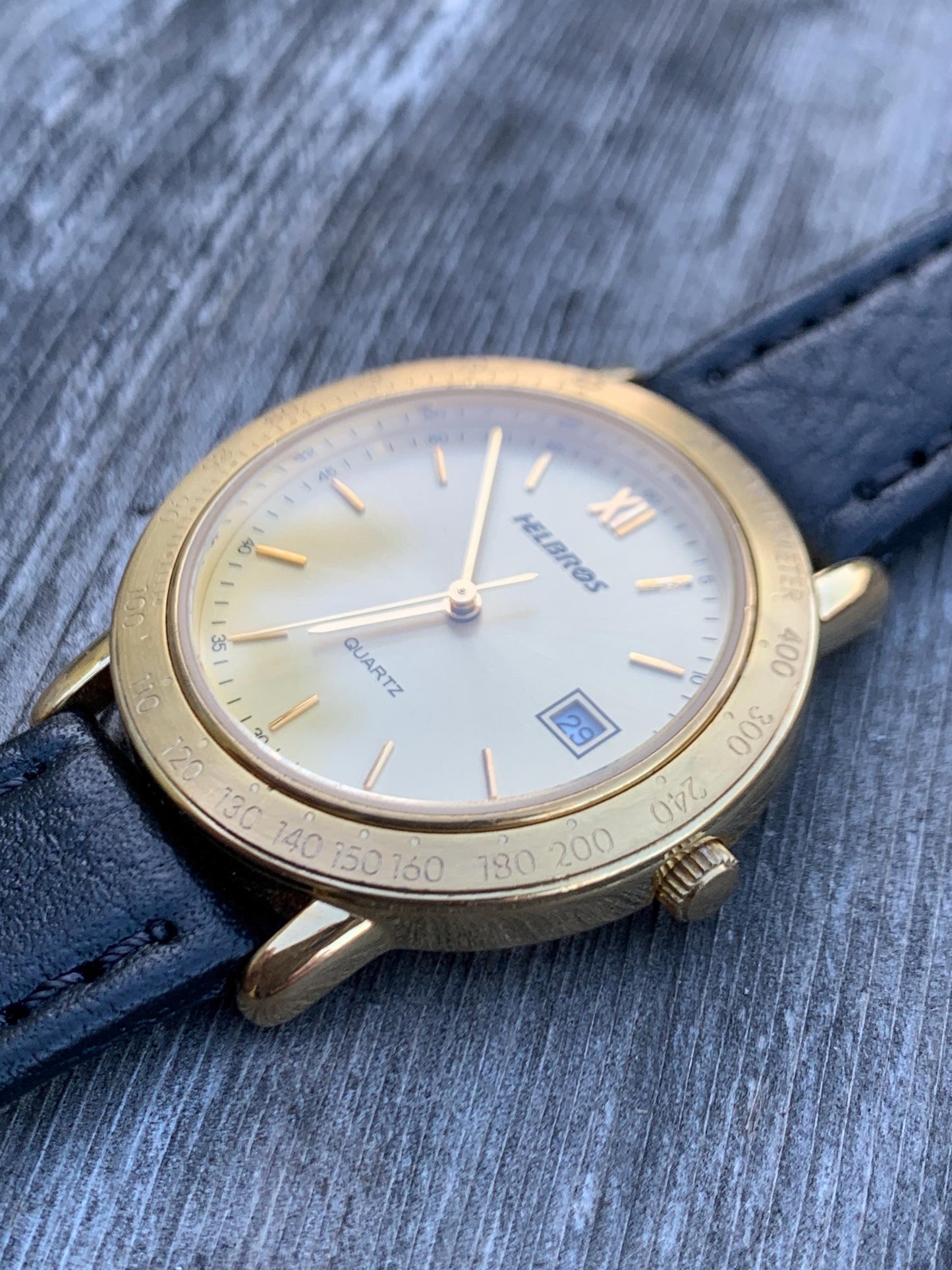 Millennial Era Helbros Quartz Watch Gold Tone Finish, Tachymeter Bezel, Gold Dial with Date New battery. New Black Calf Leather Band.