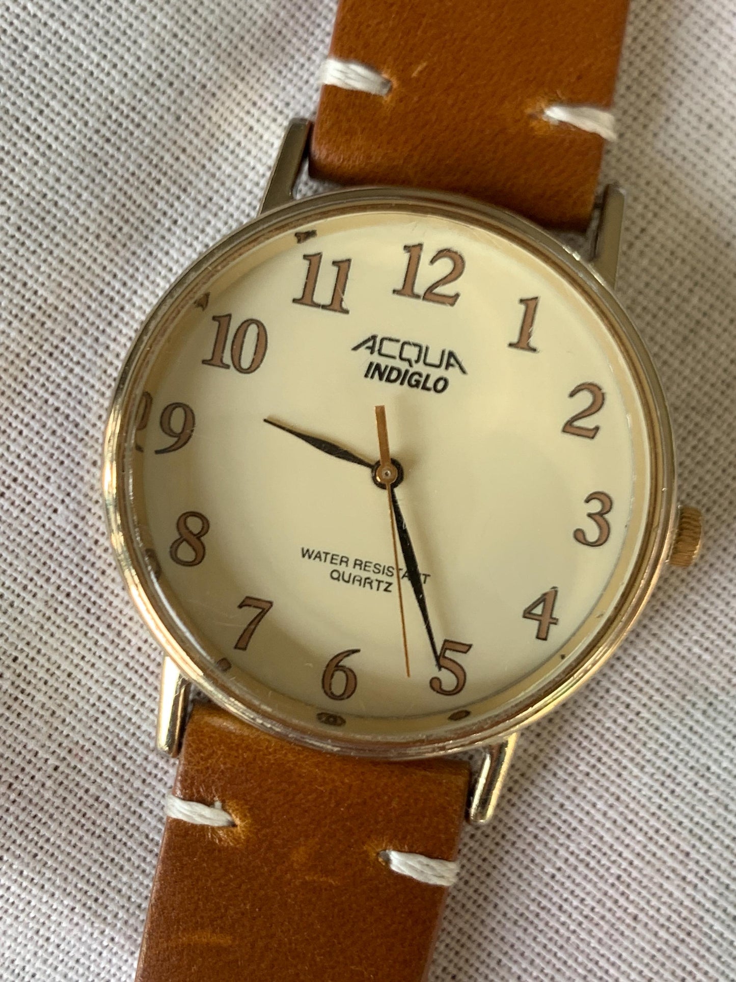 Creamy Retro 34.5mm Acqua by Timex Indiglo Quartz Watch. Goldtone. Y2K Survivor w/New Battery, New Classic Retro Light Brown Leather Strap.