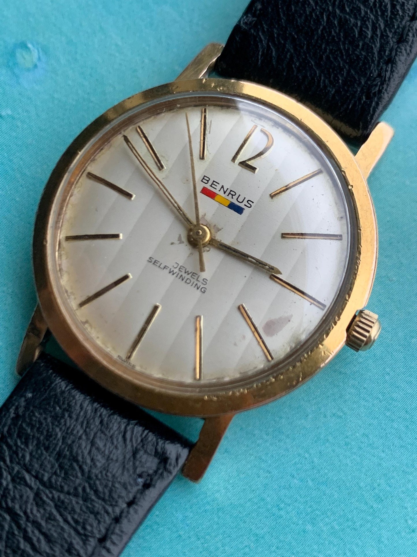 Late 1950s Benrus 7001 Citation Automatic. 10K Gold Plated in good working condition. Stick Indices Ribbed Dial. Self-winder w/vintage strap