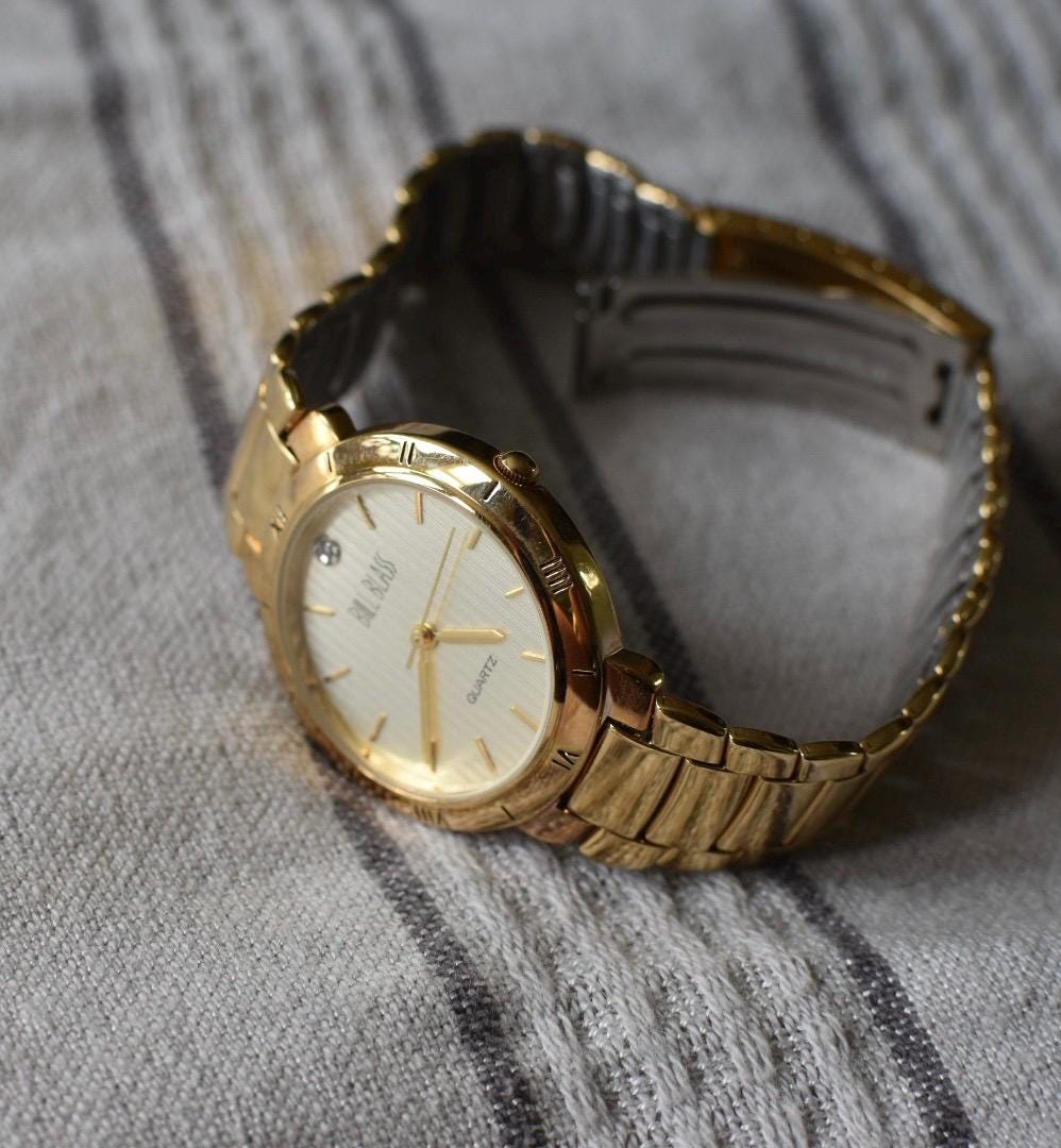 Classic Bill Blass Quartz Watch - Elegant Striped Dial with Roman Bezel, Goldtone, Excellent Condition, Integral Bracelet, Slim, All links.