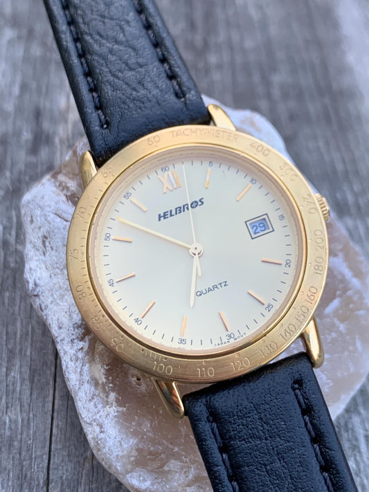 Millennial Era Helbros Quartz Watch Gold Tone Finish, Tachymeter Bezel, Gold Dial with Date New battery. New Black Calf Leather Band.