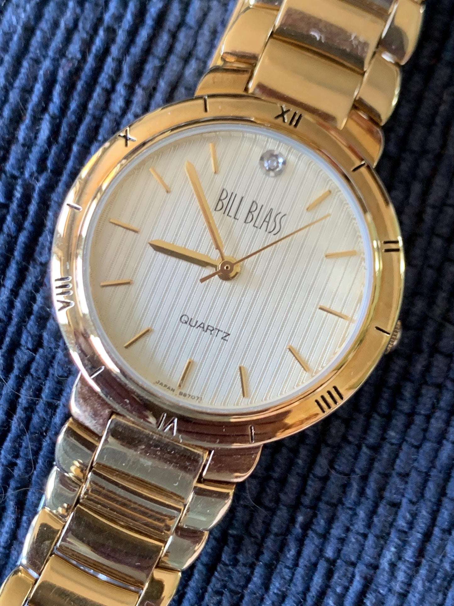 Classic Bill Blass Quartz Watch - Elegant Striped Dial with Roman Bezel, Goldtone, Excellent Condition, Integral Bracelet, Slim, All links.