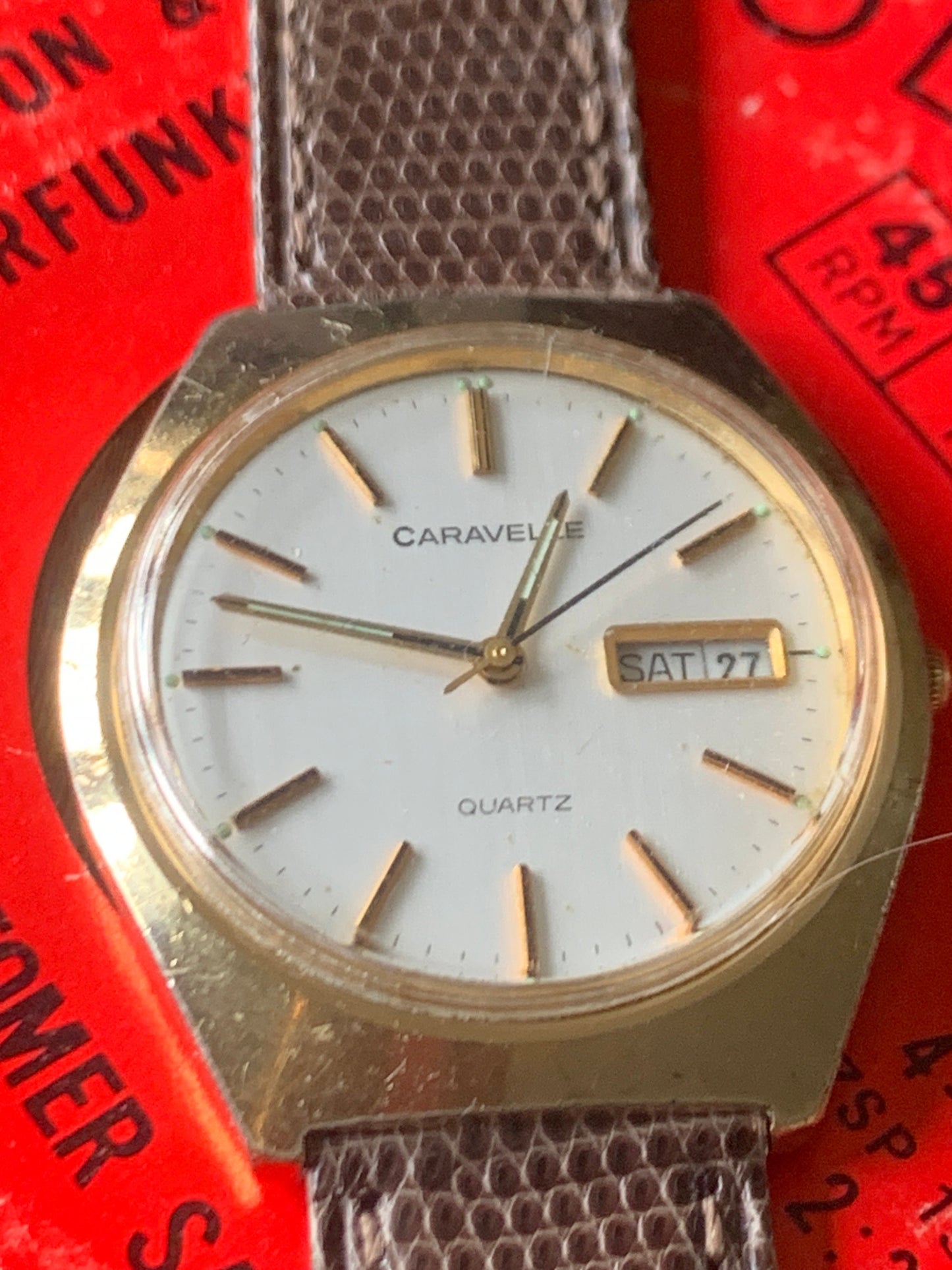 1980s Caravelle by Bolova Quartz Watch Gold Tone Finish, White Dial with Day/Date New battery. New Lizard Style Band. Overall Good Condition