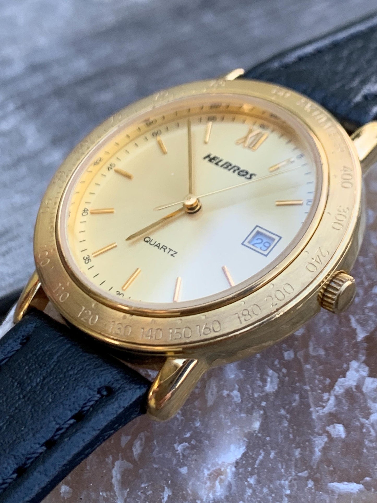 Millennial Era Helbros Quartz Watch Gold Tone Finish, Tachymeter Bezel, Gold Dial with Date New battery. New Black Calf Leather Band.