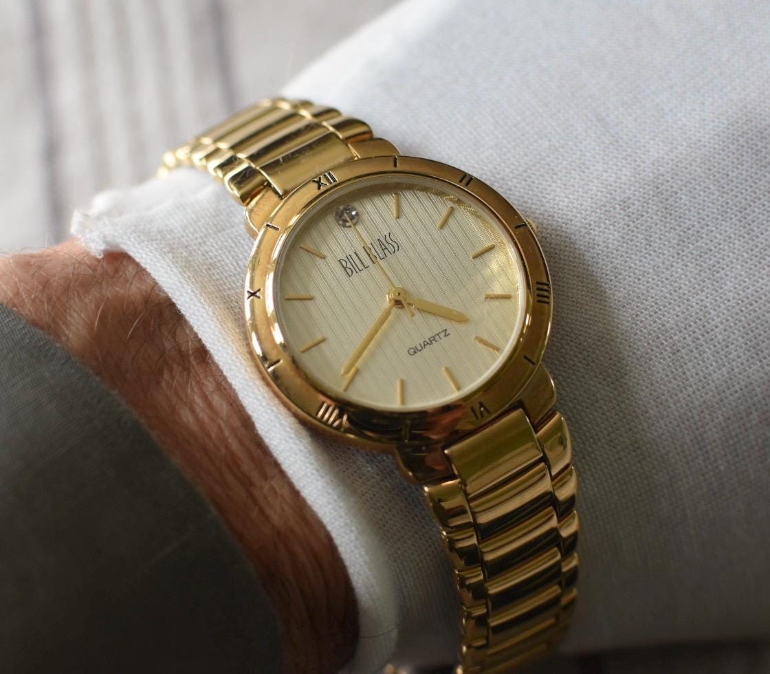 Classic Bill Blass Quartz Watch - Elegant Striped Dial with Roman Bezel, Goldtone, Excellent Condition, Integral Bracelet, Slim, All links.