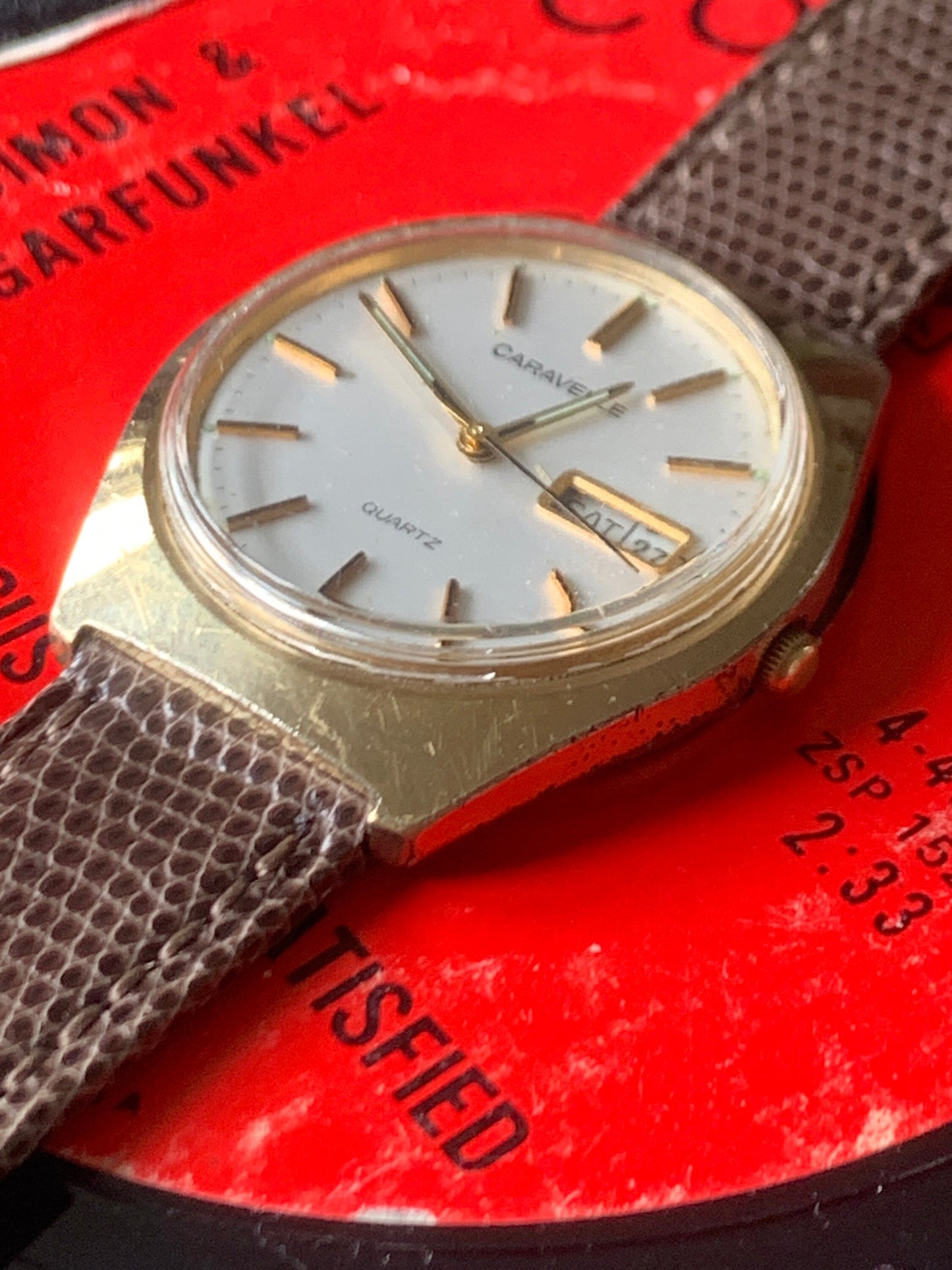 1980s Caravelle by Bolova Quartz Watch Gold Tone Finish, White Dial with Day/Date New battery. New Lizard Style Band. Overall Good Condition