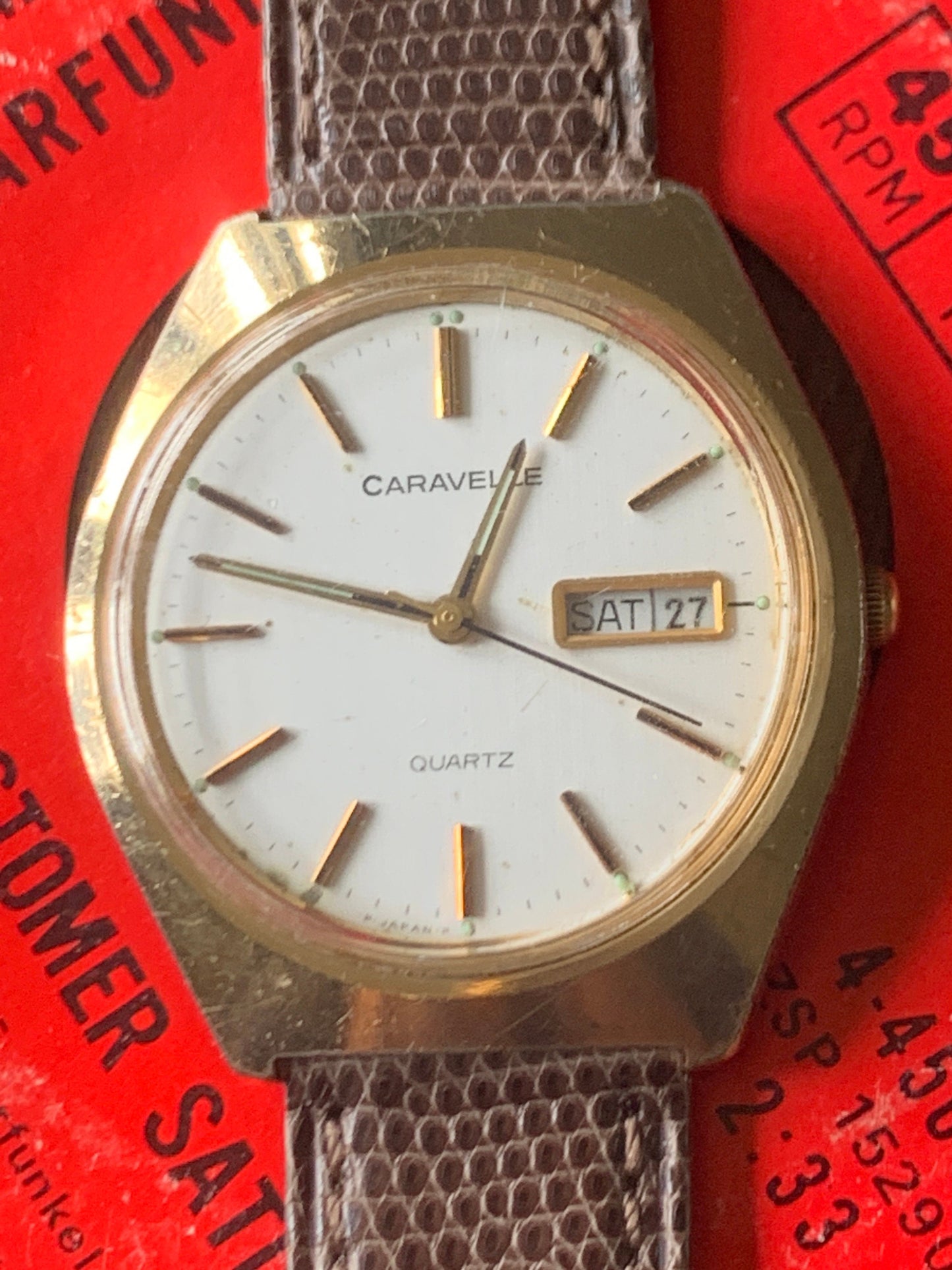 1980s Caravelle by Bolova Quartz Watch Gold Tone Finish, White Dial with Day/Date New battery. New Lizard Style Band. Overall Good Condition