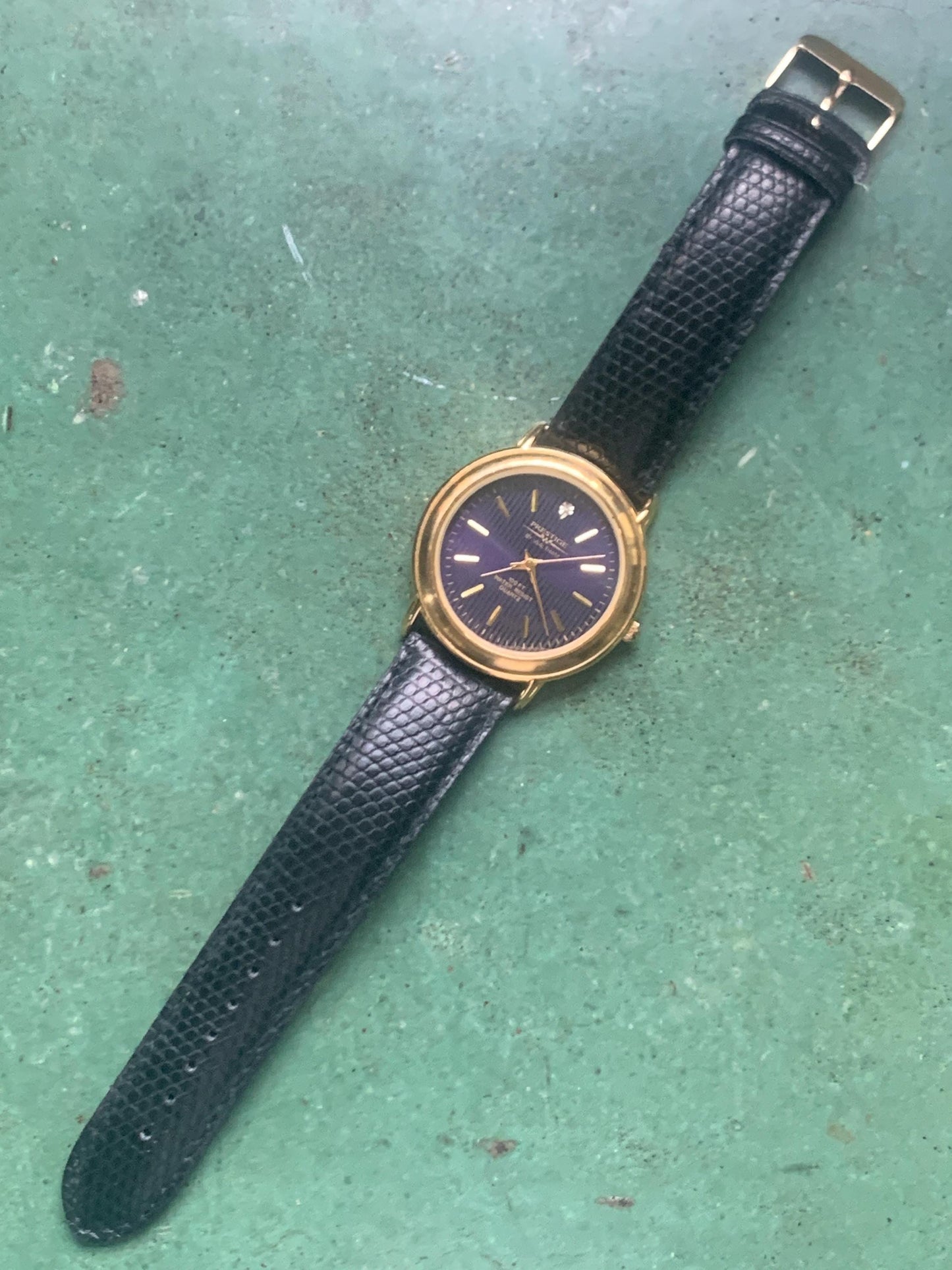 Prestige by Waltham Diamond Dial Quartz Watch.  Gold Tone with striped dial, black and deep blue. Classic Retro Style. Leather Band. Unworn.