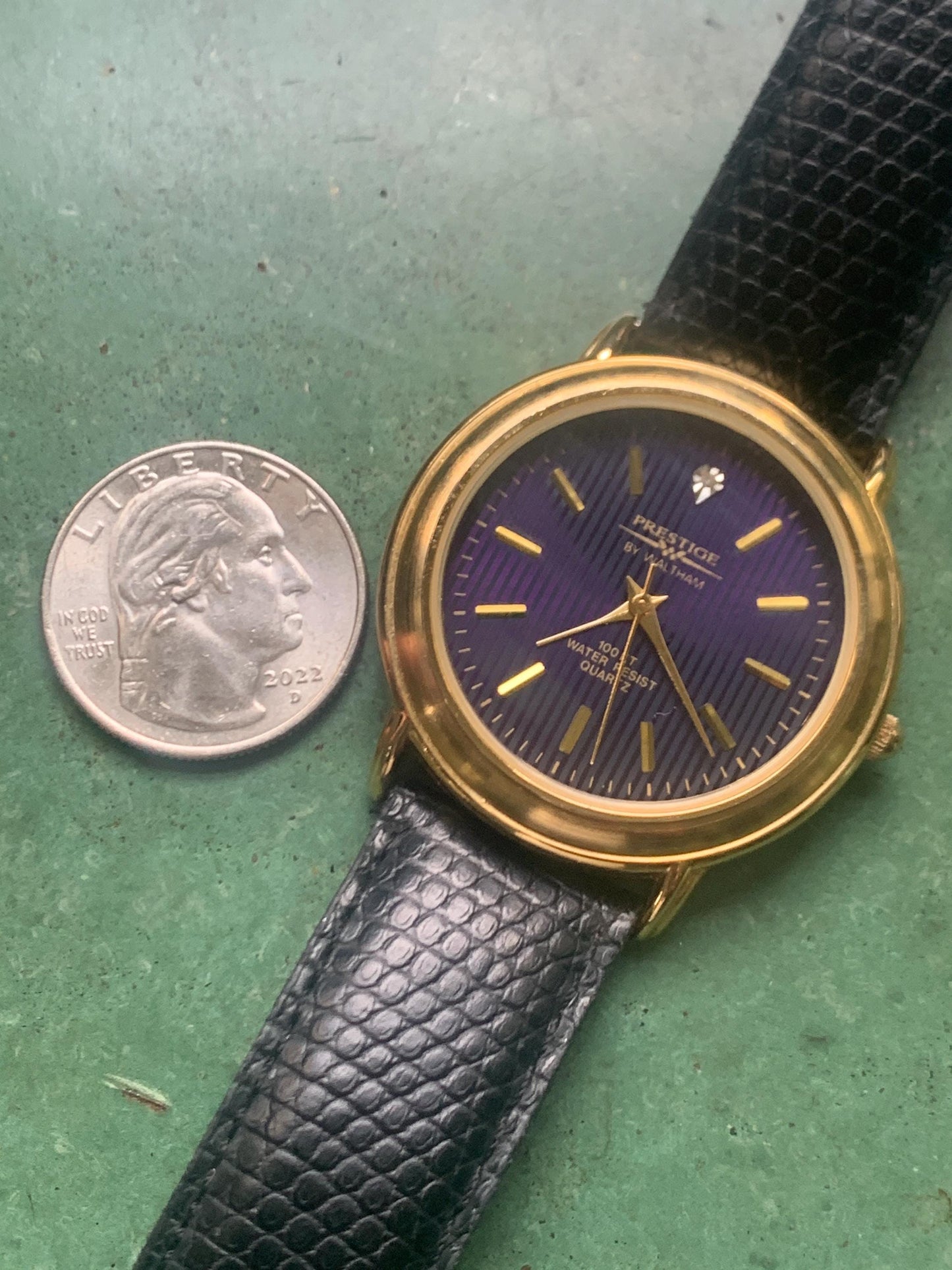 Prestige by Waltham Diamond Dial Quartz Watch.  Gold Tone with striped dial, black and deep blue. Classic Retro Style. Leather Band. Unworn.