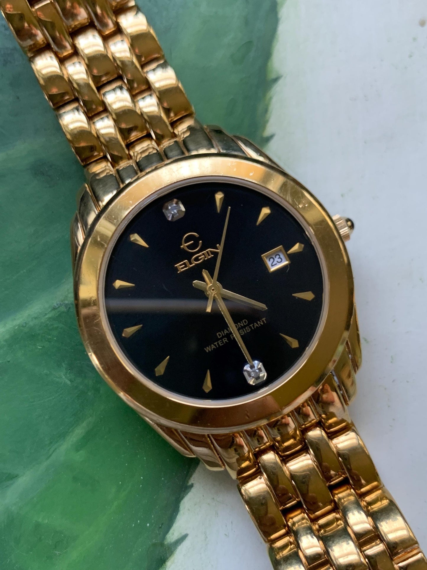 Elegant Elgin Diamond Dial Quartz Watch.  Gold Tone w black dial. Date. Classic 'Fancy' Retro Style. Bracelet. New battery. Great condition.