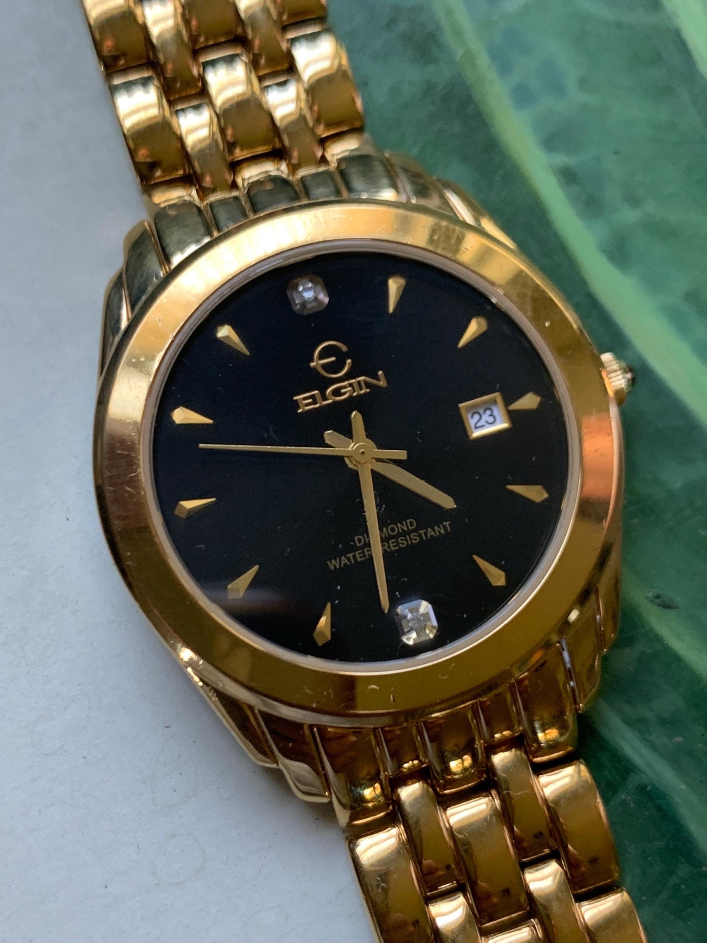 Elegant Elgin Diamond Dial Quartz Watch.  Gold Tone w black dial. Date. Classic 'Fancy' Retro Style. Bracelet. New battery. Great condition.