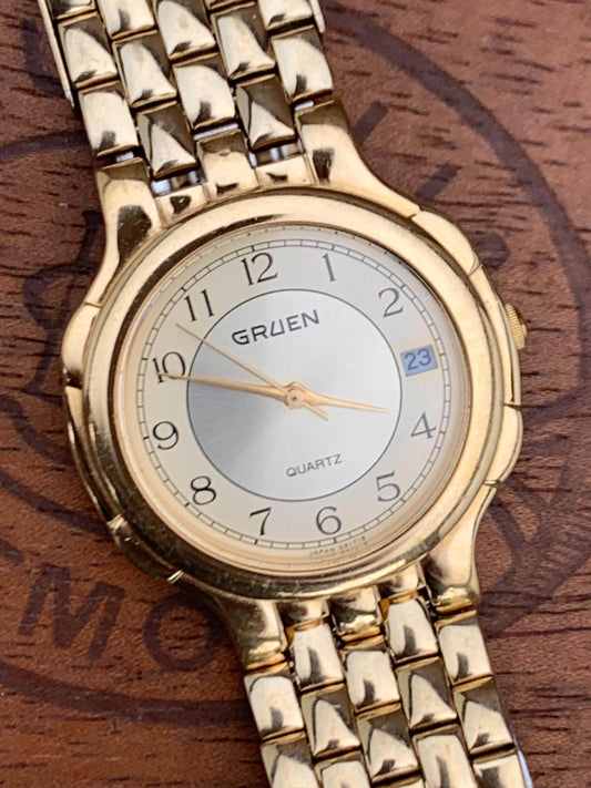 1980s Neo-Vintage Gruen Gold Tone Watch - Champagne Cream Dial with Date - Barely worn, clean, new battery, accurate. Original Integral Band