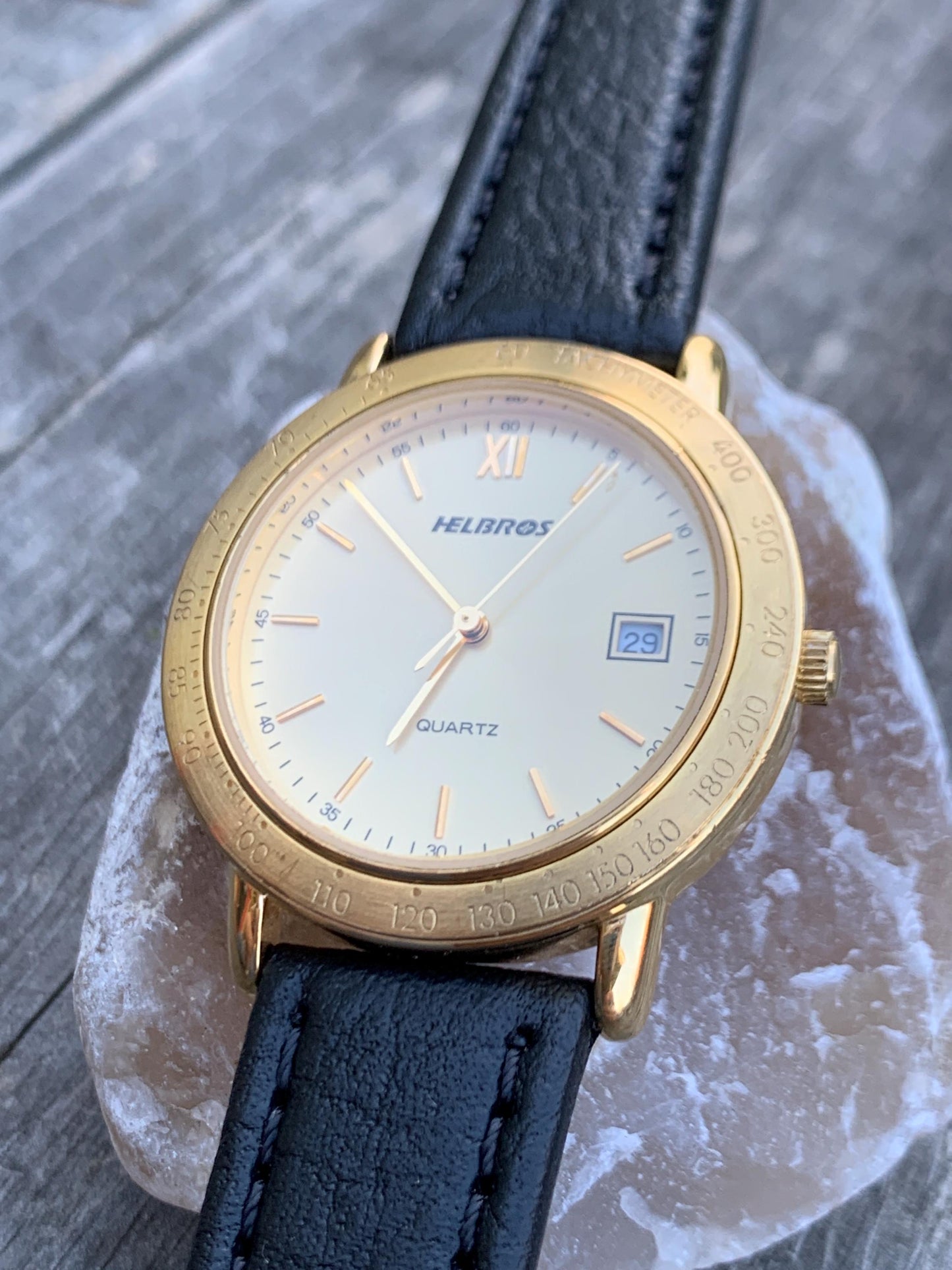 Millennial Era Helbros Quartz Watch Gold Tone Finish, Tachymeter Bezel, Gold Dial with Date New battery. New Black Calf Leather Band.