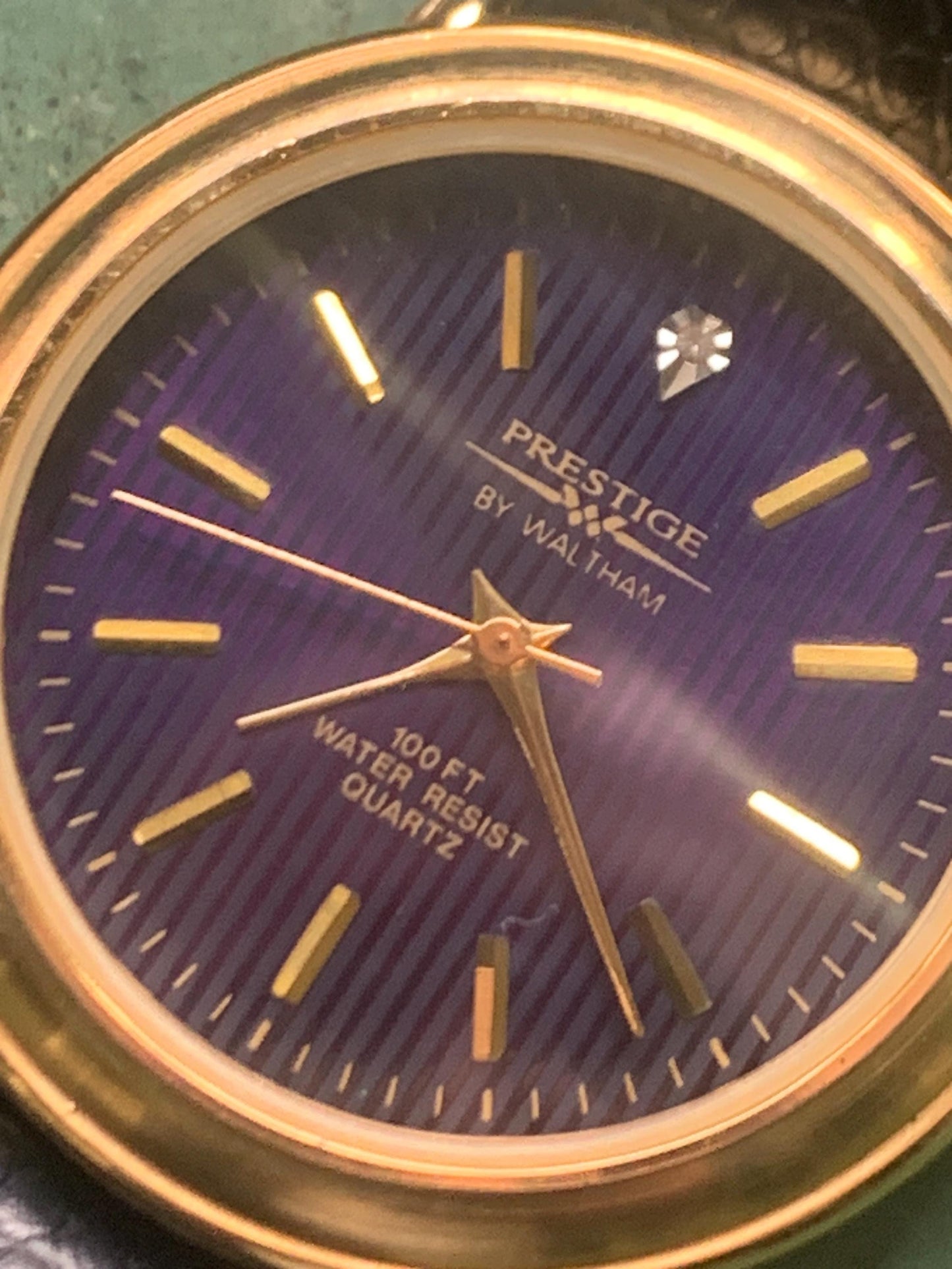 Prestige by Waltham Diamond Dial Quartz Watch.  Gold Tone with striped dial, black and deep blue. Classic Retro Style. Leather Band. Unworn.