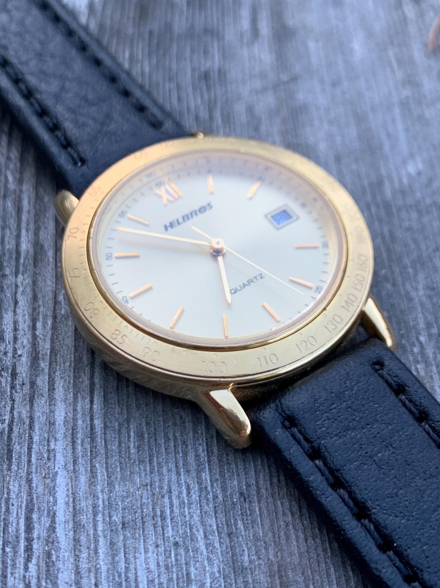 Millennial Era Helbros Quartz Watch Gold Tone Finish, Tachymeter Bezel, Gold Dial with Date New battery. New Black Calf Leather Band.