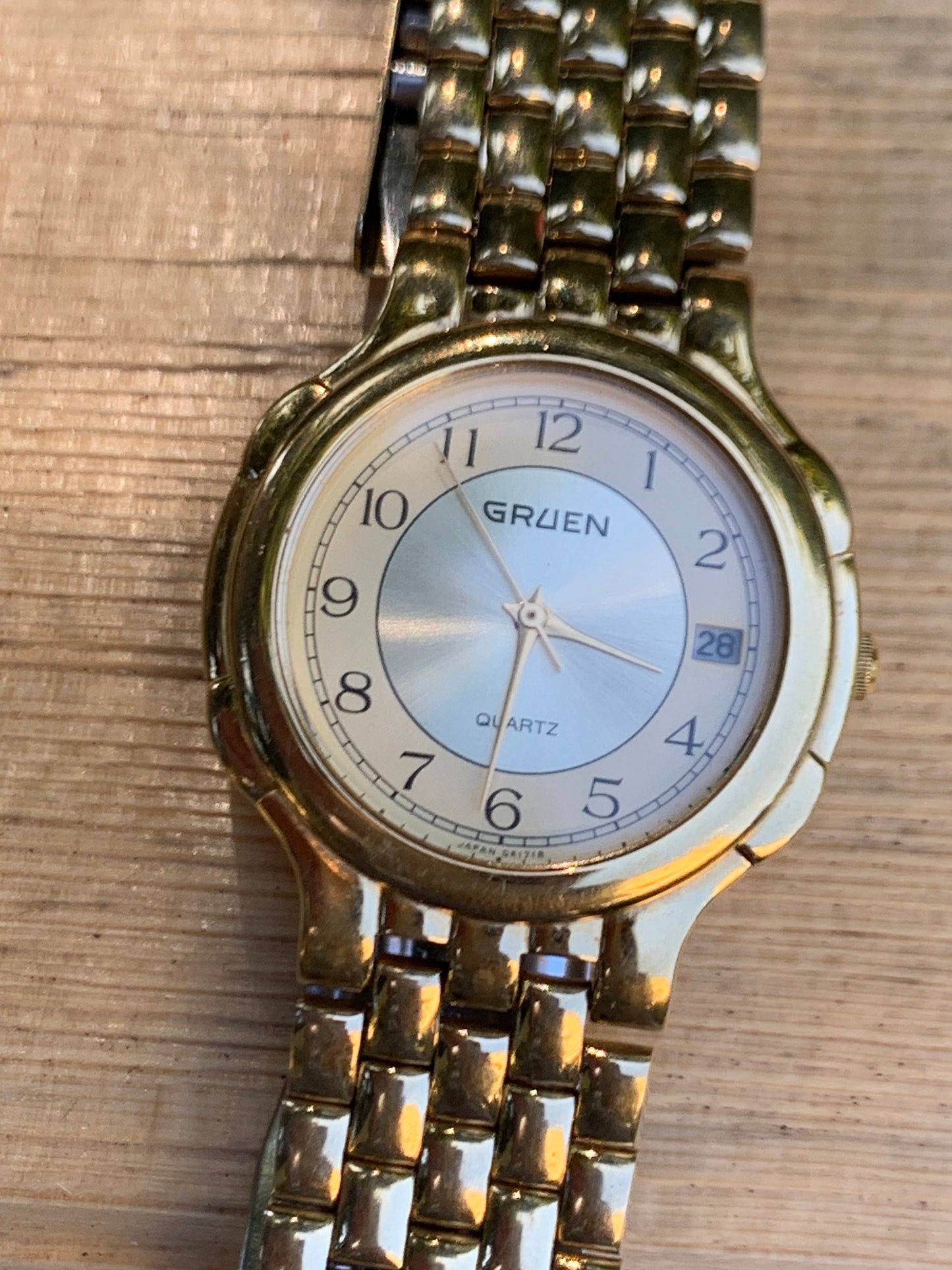 1980s Neo-Vintage Gruen Gold Tone Watch - Champagne Cream Dial with Date - Barely worn, clean, new battery, accurate. Original Integral Band