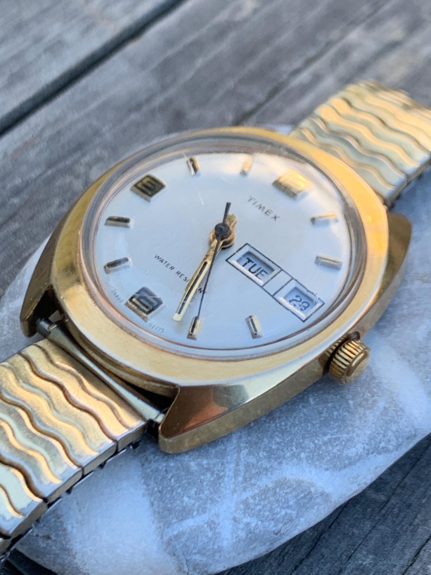 1975 Timex Marlin Winder Watch, Goldtone Case w/Champagne Calendar Dial. Decent Overall Condition with Period Expanding Band. Works!