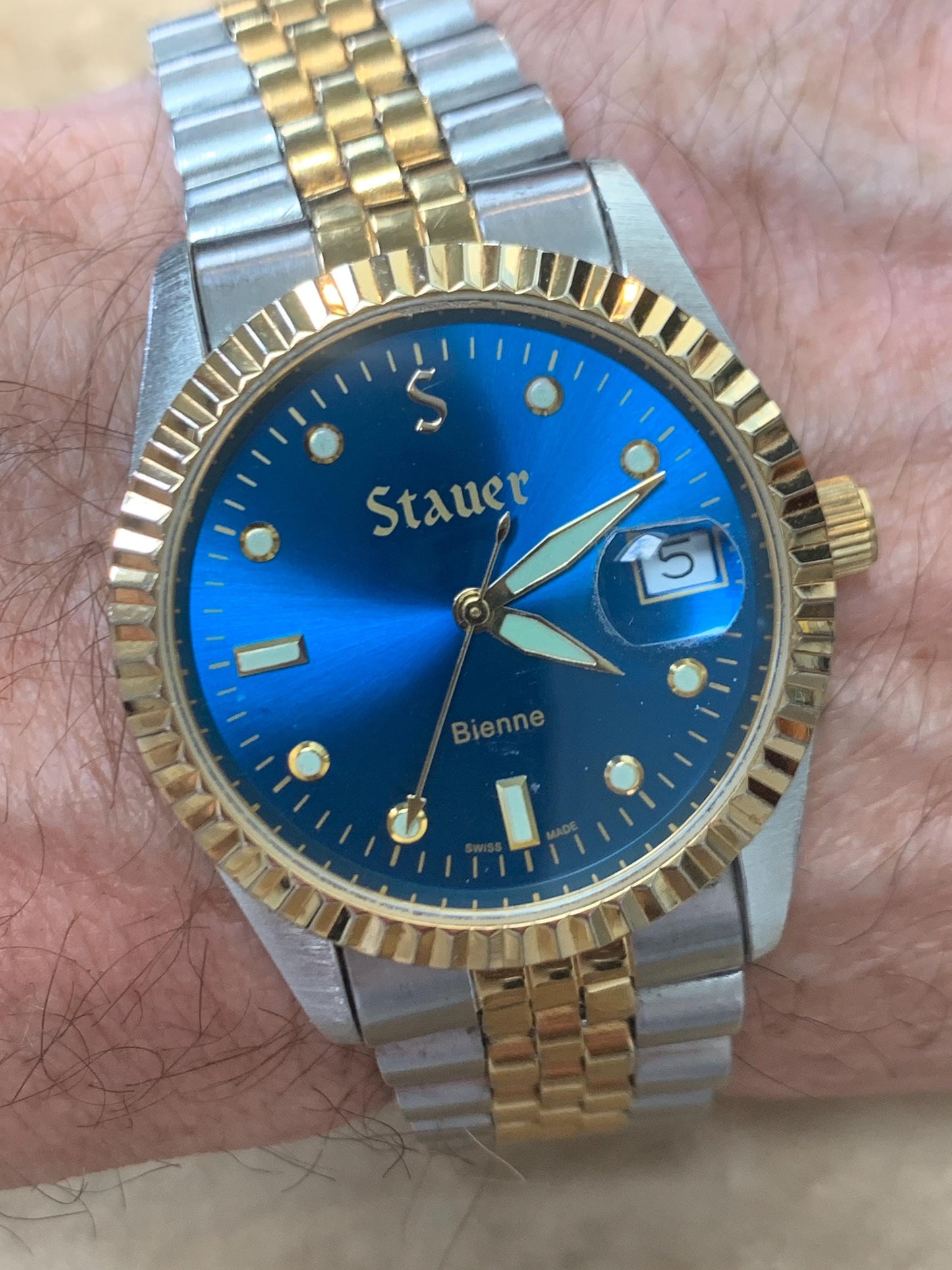 Classic Blue Dial Presidential Stauer Bienne Swiss Made Watch w/Date. Lightly worn, good condition. Quartz, New Battery, Two-Tone Bracelet.