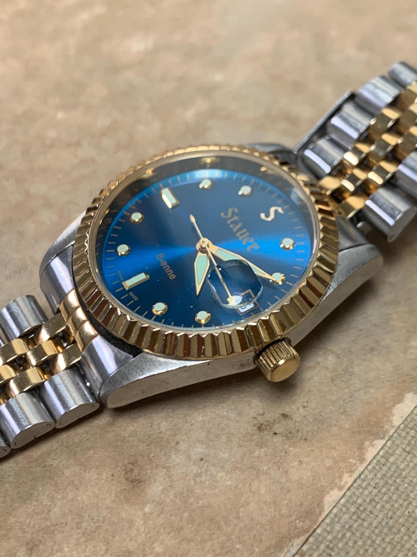 Classic Blue Dial Presidential Stauer Bienne Swiss Made Watch w/Date. Lightly worn, good condition. Quartz, New Battery, Two-Tone Bracelet.