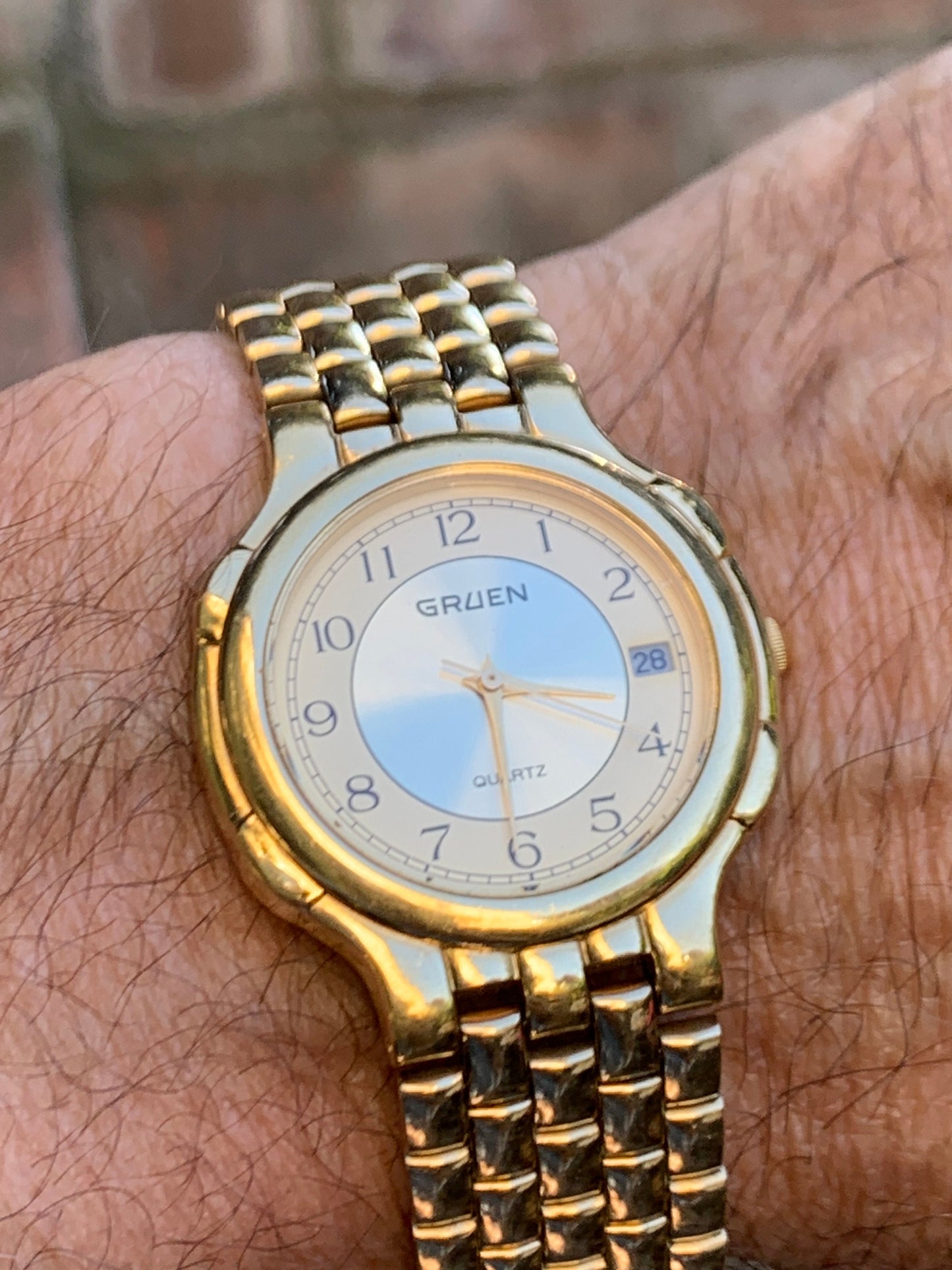 1980s Neo-Vintage Gruen Gold Tone Watch - Champagne Cream Dial with Date - Barely worn, clean, new battery, accurate. Original Integral Band