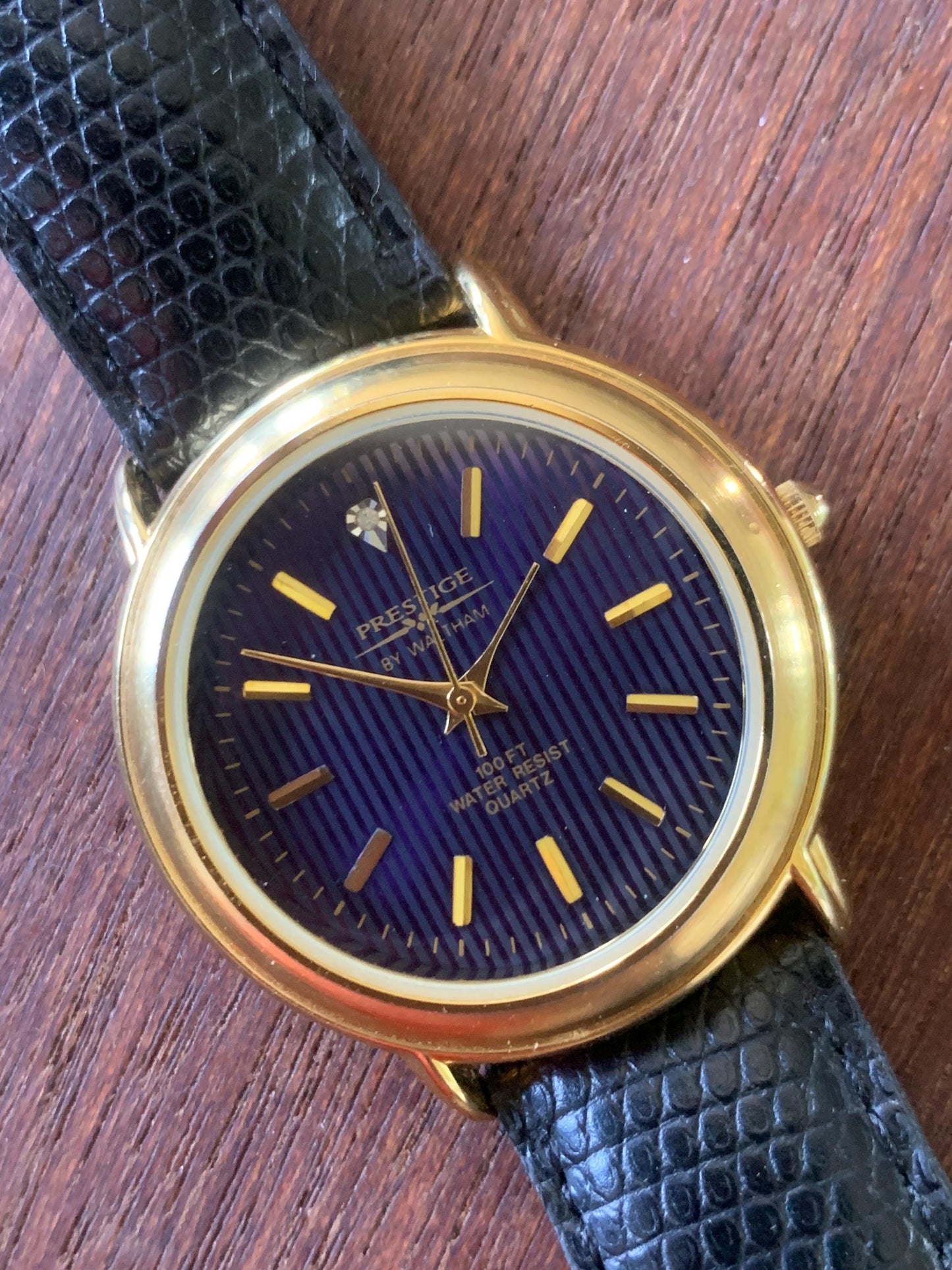 Prestige by Waltham Diamond Dial Quartz Watch.  Gold Tone with striped dial, black and deep blue. Classic Retro Style. Leather Band. Unworn.