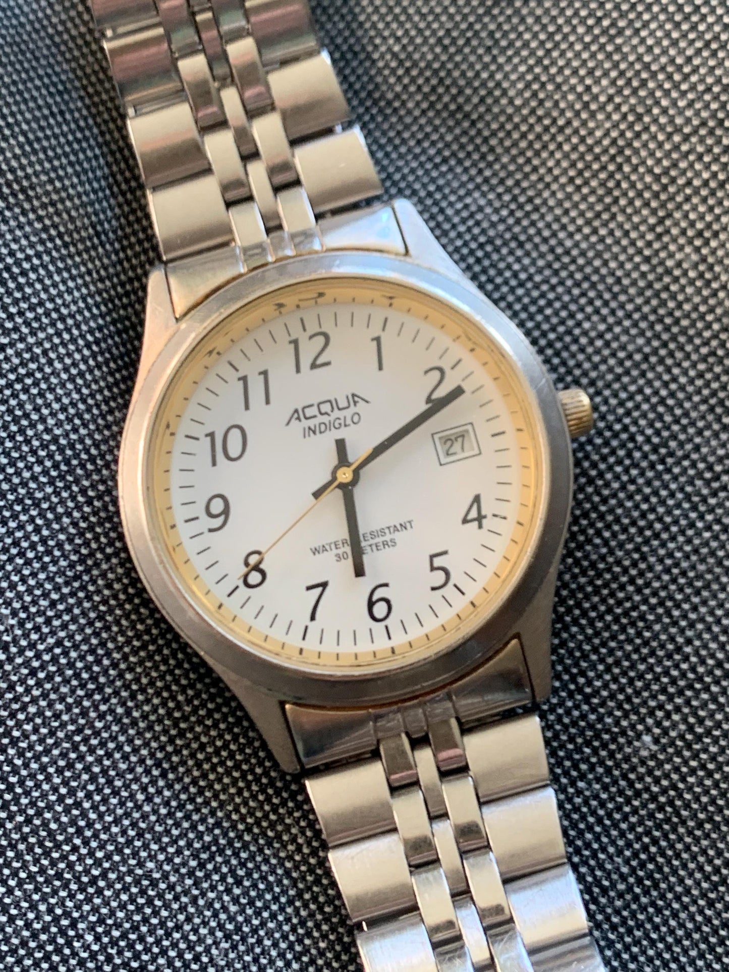Well Worn Millennium Timex Acqua Indiglo Watch with White Dial, Easy Read Black Numerals, Date, and classic 70s style Retro Metal Strap.