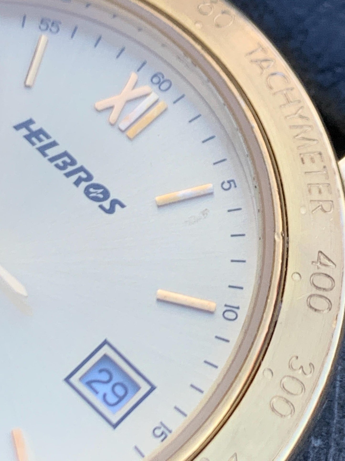 Millennial Era Helbros Quartz Watch Gold Tone Finish, Tachymeter Bezel, Gold Dial with Date New battery. New Black Calf Leather Band.