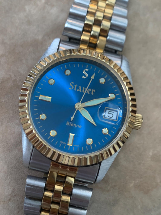 Classic Blue Dial Presidential Stauer Bienne Swiss Made Watch w/Date. Lightly worn, good condition. Quartz, New Battery, Two-Tone Bracelet.