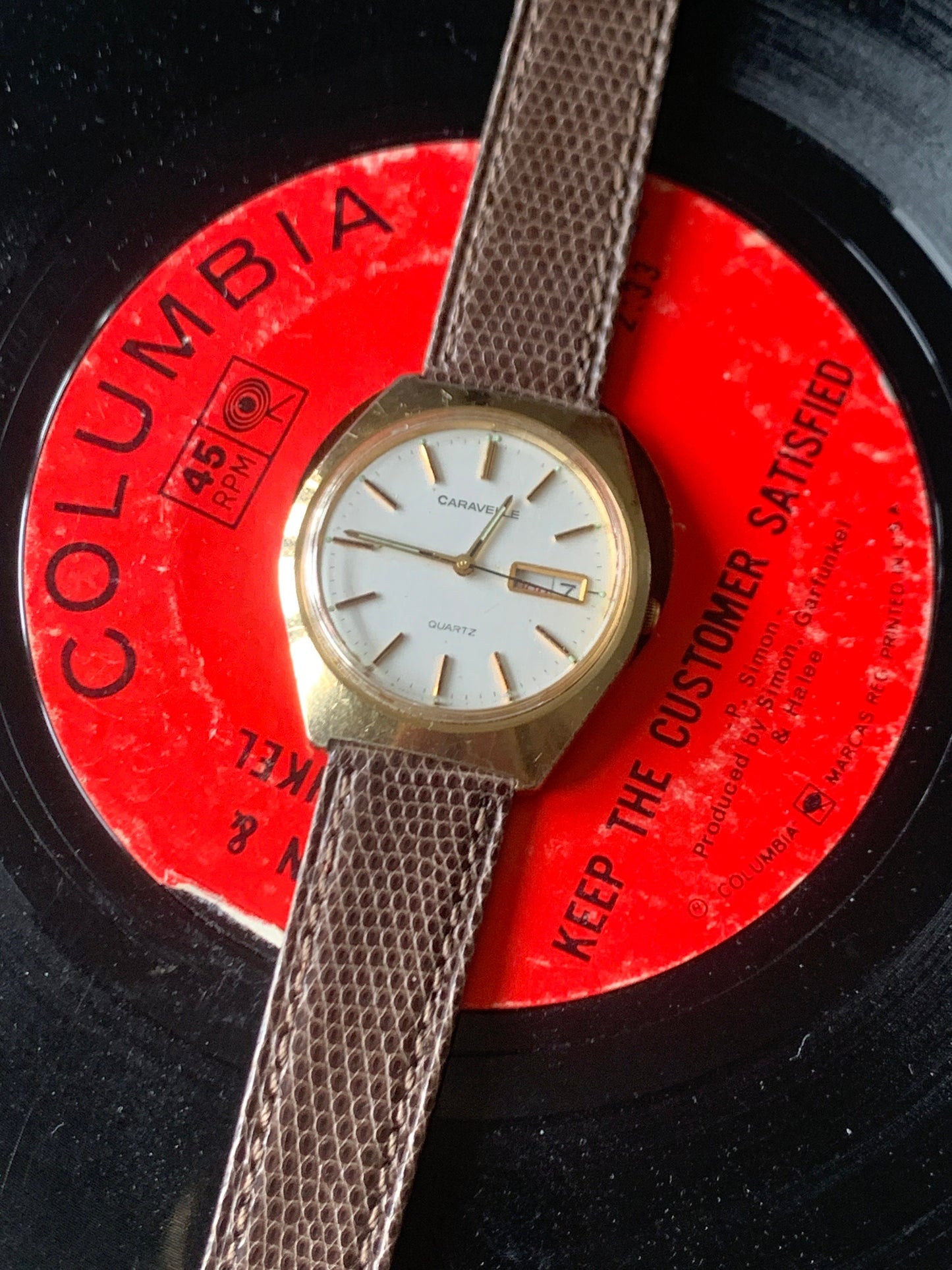 1980s Caravelle by Bolova Quartz Watch Gold Tone Finish, White Dial with Day/Date New battery. New Lizard Style Band. Overall Good Condition