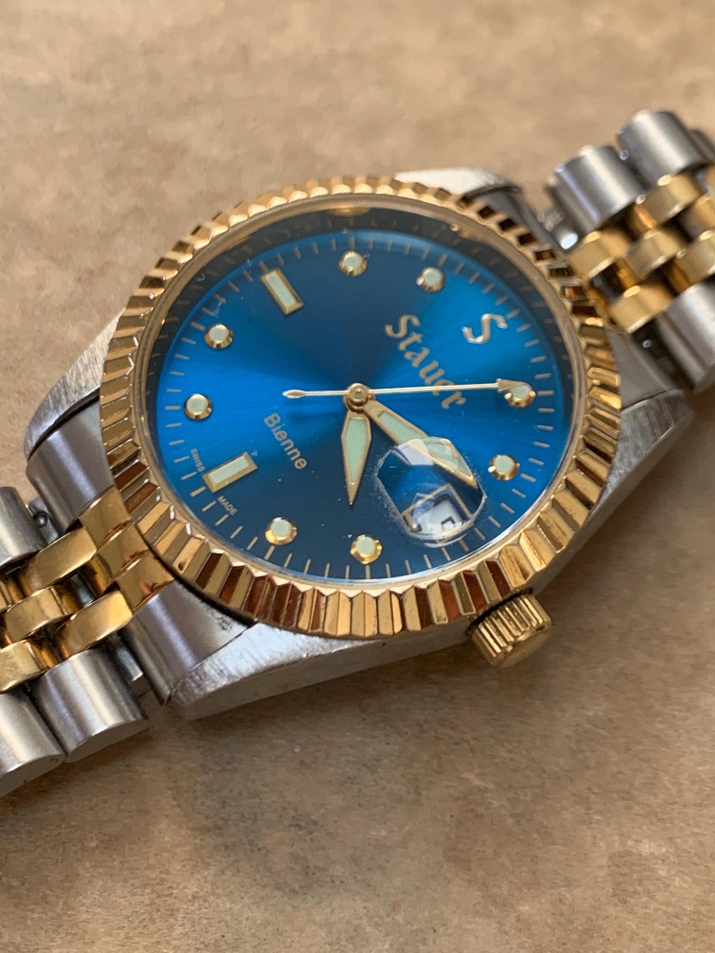 Classic Blue Dial Presidential Stauer Bienne Swiss Made Watch w/Date. Lightly worn, good condition. Quartz, New Battery, Two-Tone Bracelet.