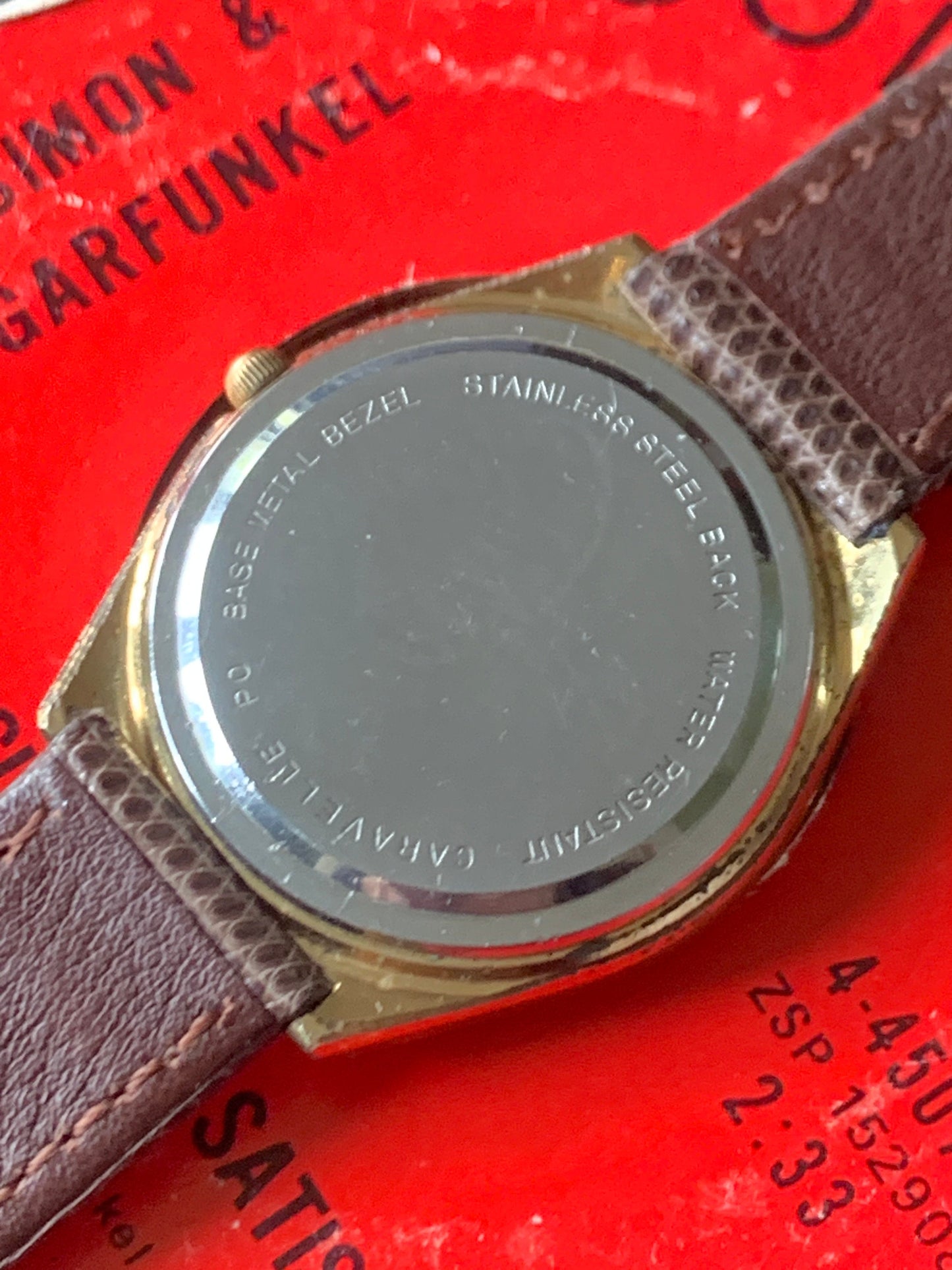 1980s Caravelle by Bolova Quartz Watch Gold Tone Finish, White Dial with Day/Date New battery. New Lizard Style Band. Overall Good Condition