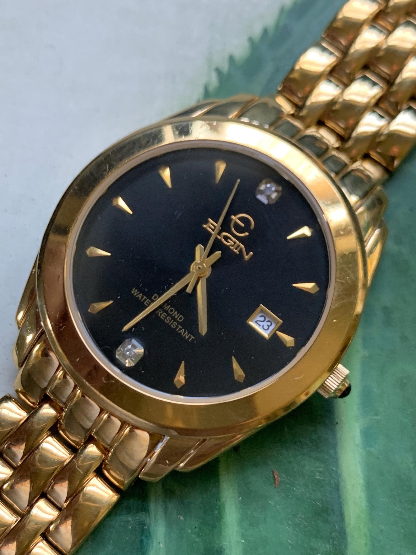 Elegant Elgin Diamond Dial Quartz Watch.  Gold Tone w black dial. Date. Classic 'Fancy' Retro Style. Bracelet. New battery. Great condition.
