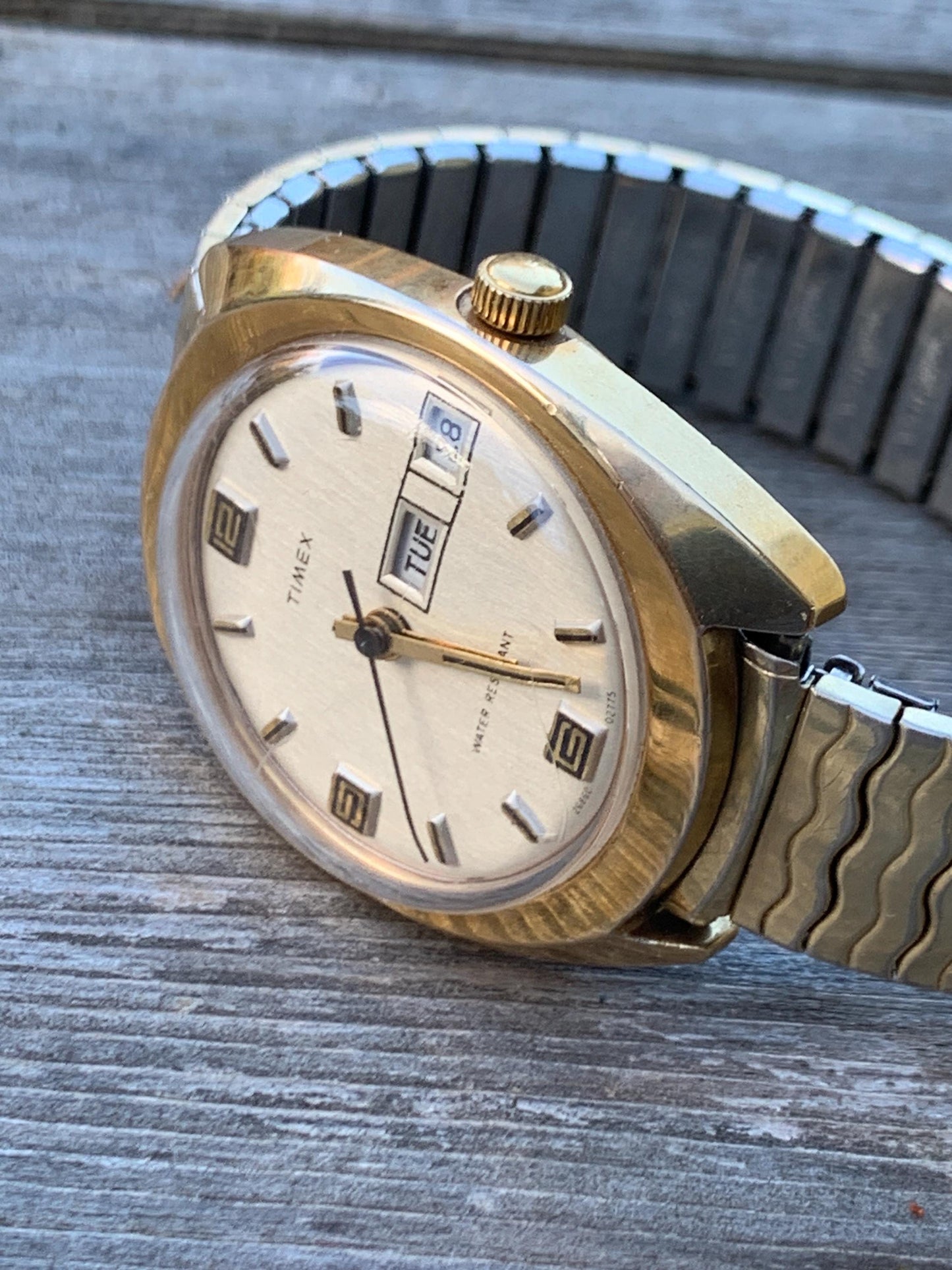 1975 Timex Marlin Winder Watch, Goldtone Case w/Champagne Calendar Dial. Decent Overall Condition with Period Expanding Band. Works!
