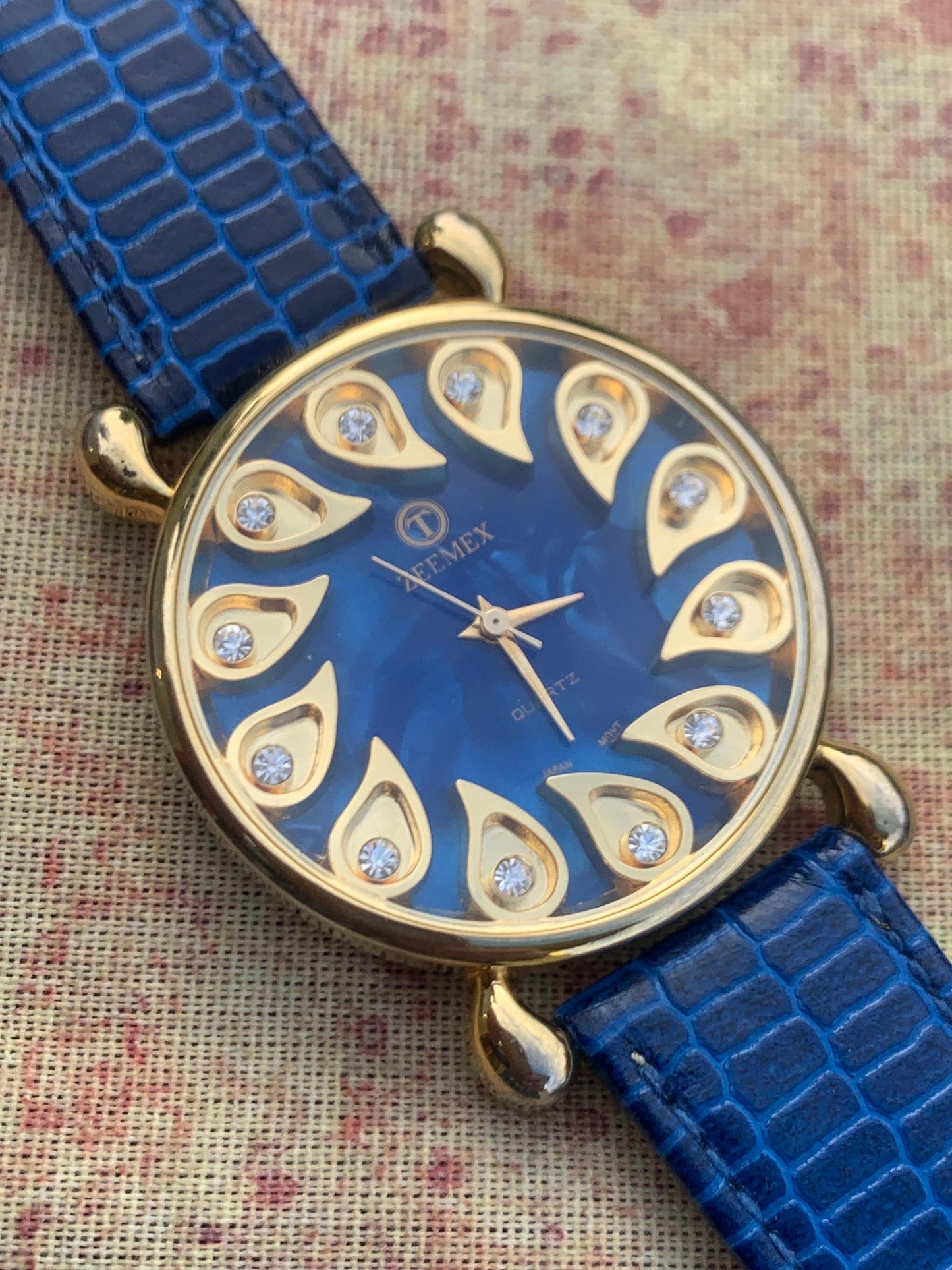 Luminescent Blue 1990s Quartz Watch - 37mm, Gold Indices with Floating Jewels on Ultra Radiant Blue Dial. New battery & NOS blue strap. Fun!