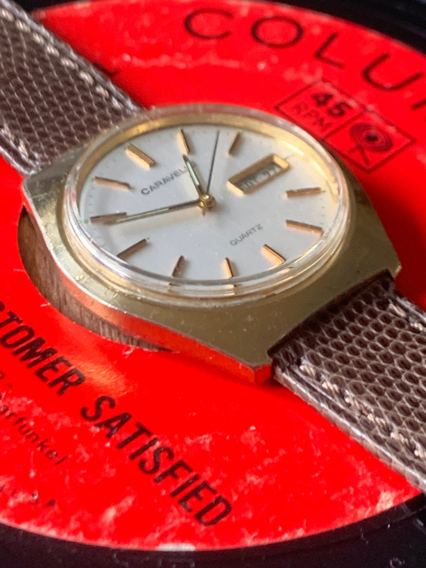 1980s Caravelle by Bolova Quartz Watch Gold Tone Finish, White Dial with Day/Date New battery. New Lizard Style Band. Overall Good Condition