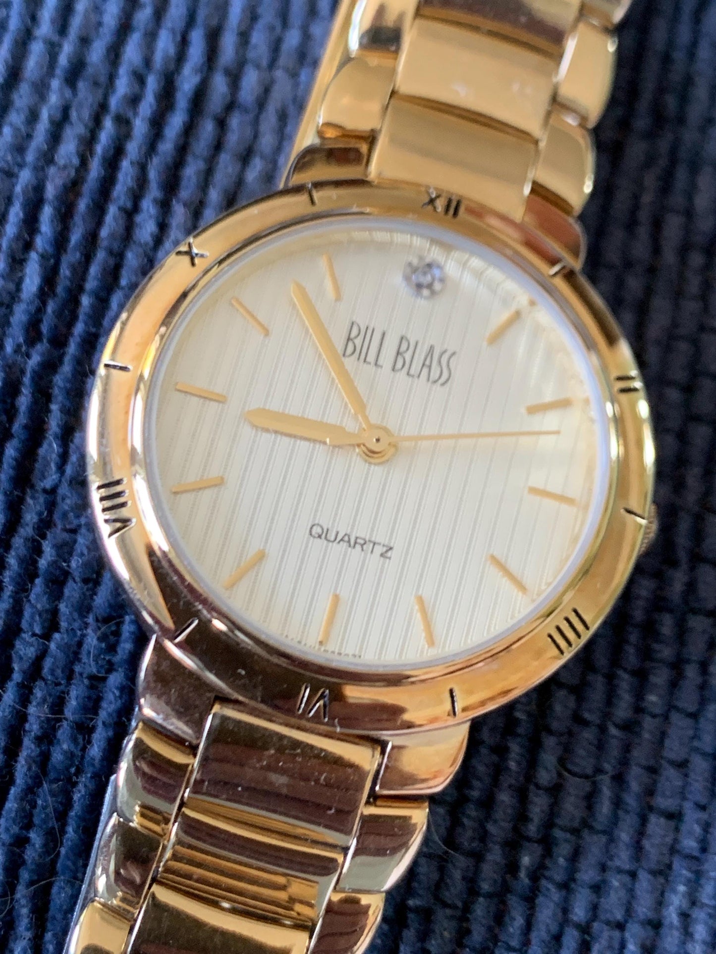 Classic Bill Blass Quartz Watch - Elegant Striped Dial with Roman Bezel, Goldtone, Excellent Condition, Integral Bracelet, Slim, All links.