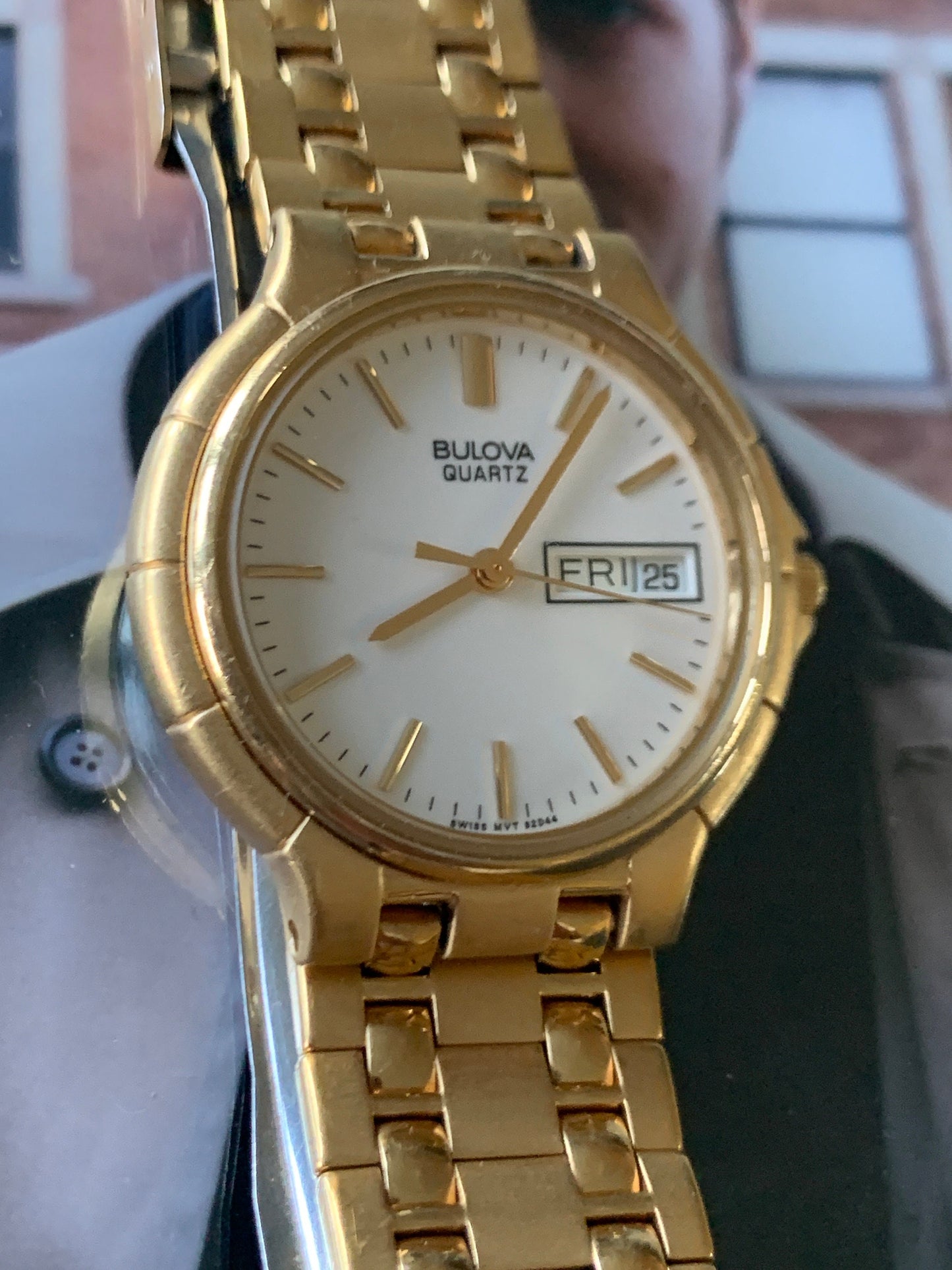1988 Bulova Quartz Watch Gold Tone Finish, White Dial with Day/Date New battery. Original, integral metal band. Neo Vintage Quartz. Great.