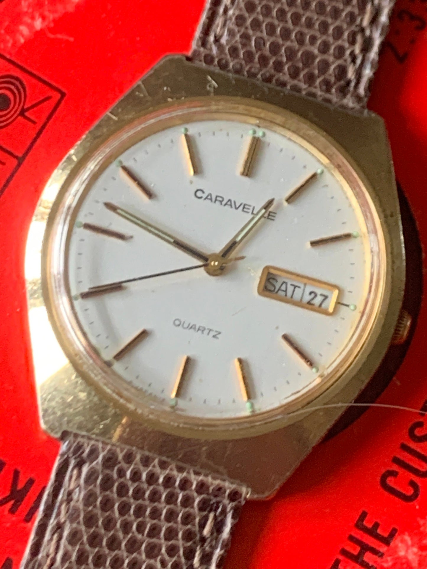 1980s Caravelle by Bolova Quartz Watch Gold Tone Finish, White Dial with Day/Date New battery. New Lizard Style Band. Overall Good Condition