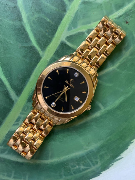 Elegant Elgin Diamond Dial Quartz Watch.  Gold Tone w black dial. Date. Classic 'Fancy' Retro Style. Bracelet. New battery. Great condition.