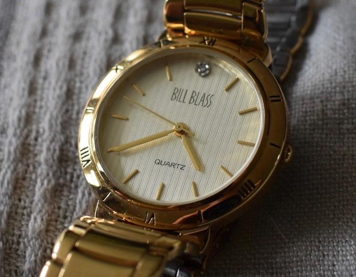 Classic Bill Blass Quartz Watch - Elegant Striped Dial with Roman Bezel, Goldtone, Excellent Condition, Integral Bracelet, Slim, All links.