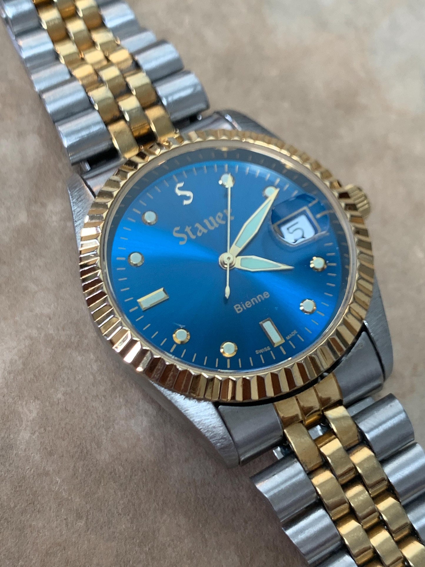 Classic Blue Dial Presidential Stauer Bienne Swiss Made Watch w/Date. Lightly worn, good condition. Quartz, New Battery, Two-Tone Bracelet.