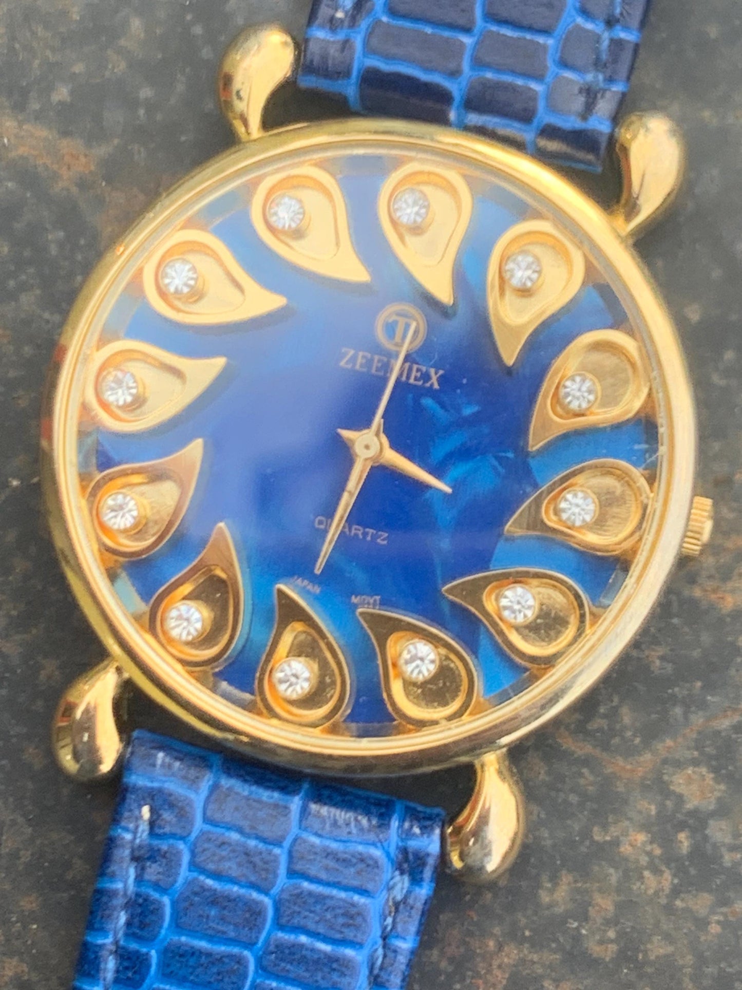 Luminescent Blue 1990s Quartz Watch - 37mm, Gold Indices with Floating Jewels on Ultra Radiant Blue Dial. New battery & NOS blue strap. Fun!