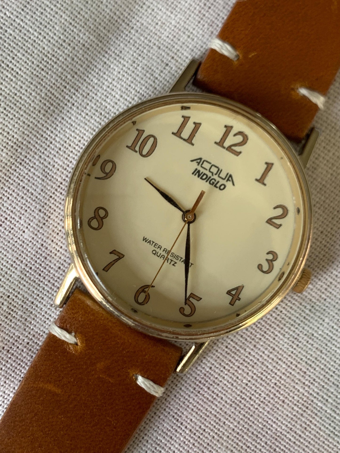 Creamy Retro 34.5mm Acqua by Timex Indiglo Quartz Watch. Goldtone. Y2K Survivor w/New Battery, New Classic Retro Light Brown Leather Strap.