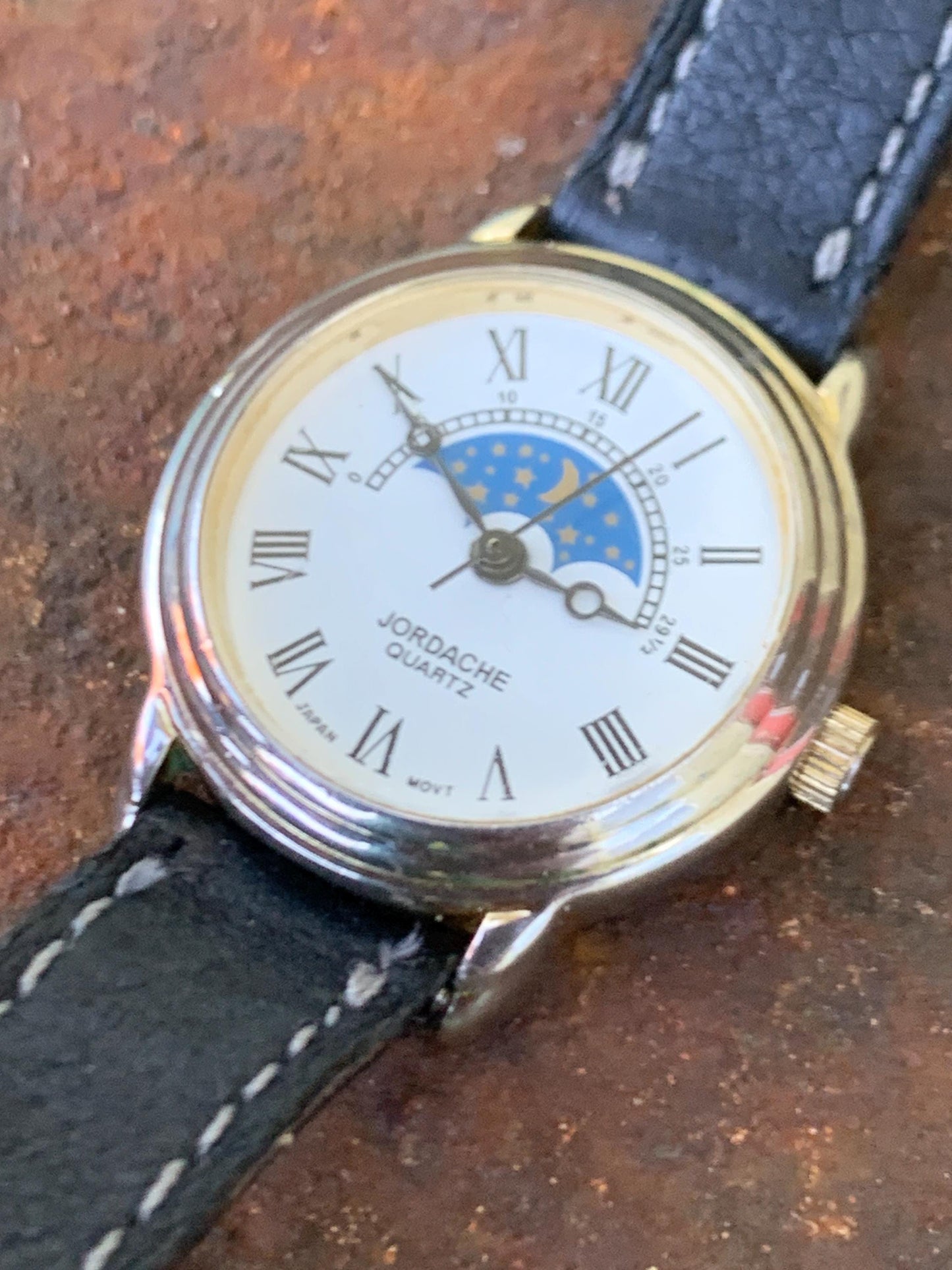 Jordache Moon Motif Watch - Women's FIXED Moon Motif Dial Design:  New battery, vintage leather strap. Roman Dial, Good Condition.